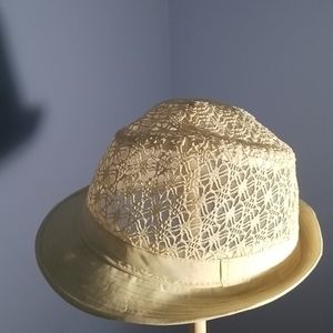 A fedora hat with lace detailing